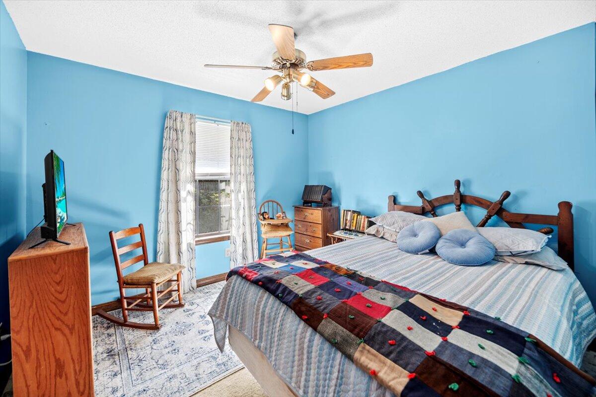 5351 Highway 4 Baker, FL 32531 - Photo 9 of 9 a bedroom with two beds and a chandelier