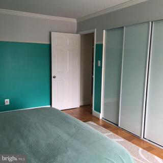 3100 South Manchester Street, Unit 727 Falls Church, VA 22044 - Photo 12 of 23 an empty room with closet and windows
