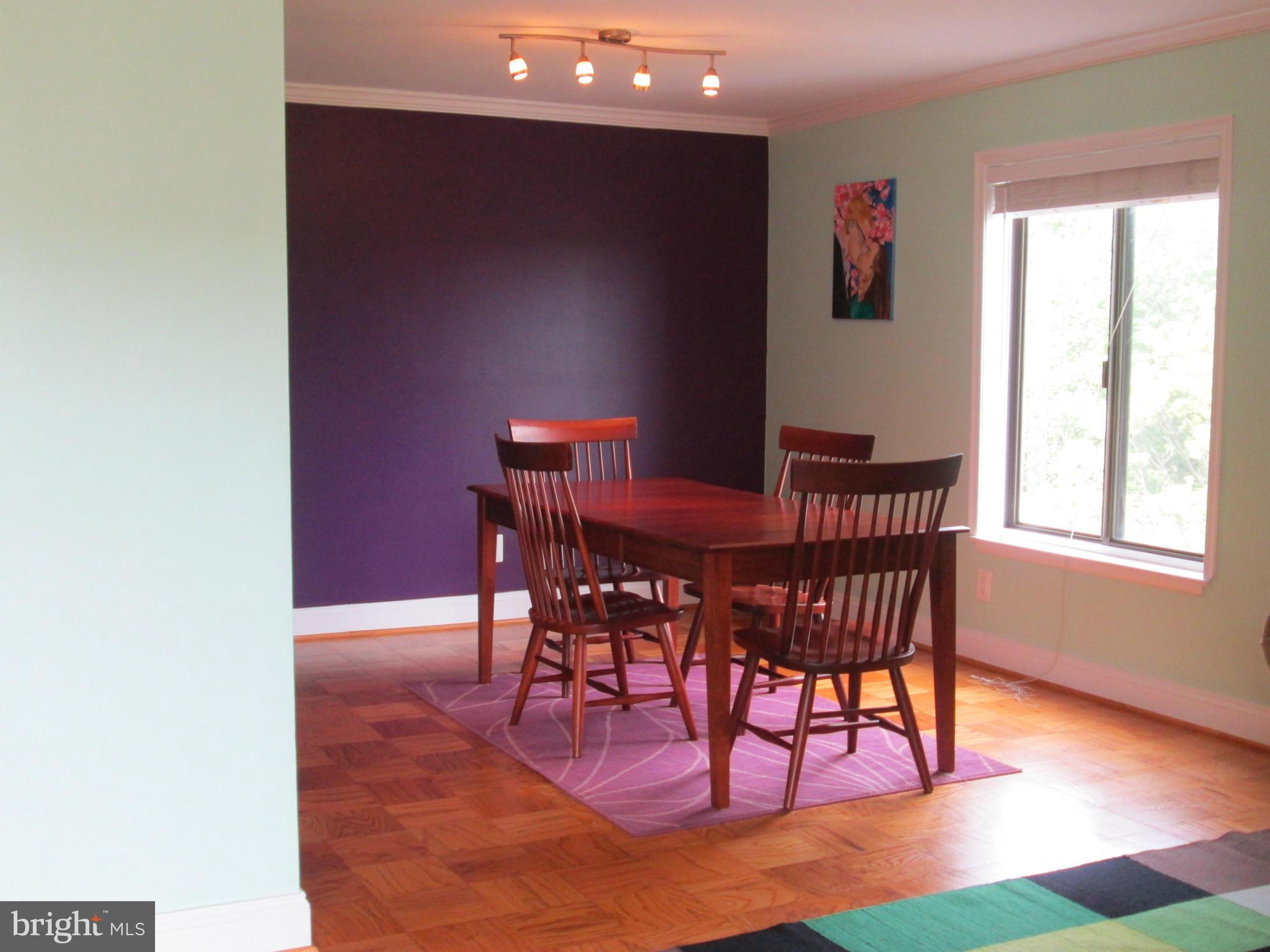3100 South Manchester Street, Unit 727 Falls Church, VA 22044 - Photo 4 of 23 a view of a dining room with furniture and wooden floor