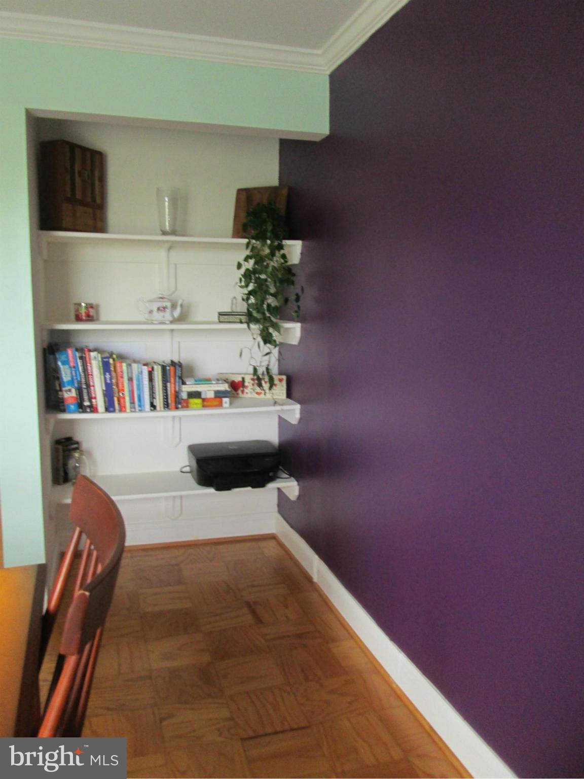 3100 South Manchester Street, Unit 727 Falls Church, VA 22044 - Photo 5 of 23 a living room with furniture and a book shelf