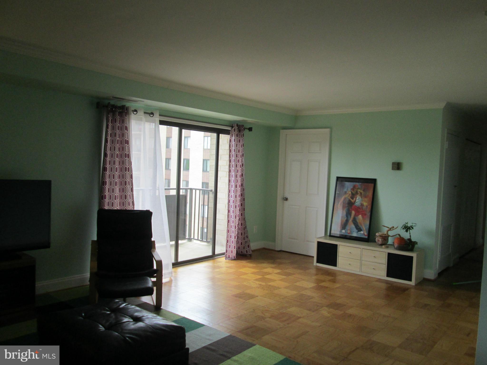 3100 South Manchester Street, Unit 727 Falls Church, VA 22044 - Photo 7 of 23 a living room with furniture and a flat screen tv