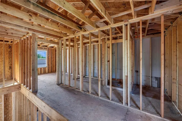a view of a white building with large windows