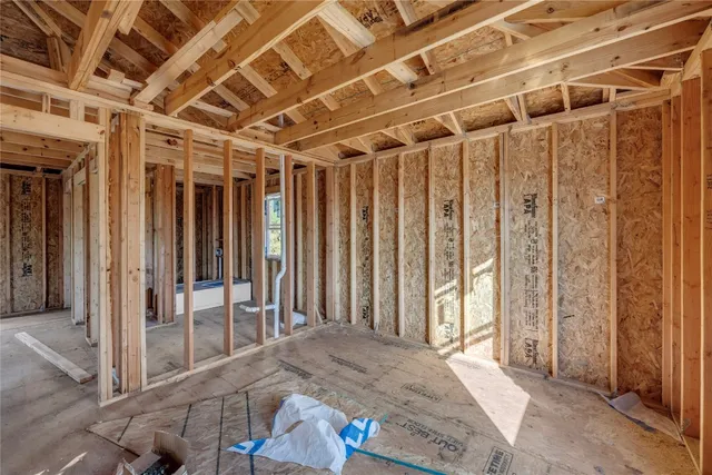 a view of empty room with wooden walls