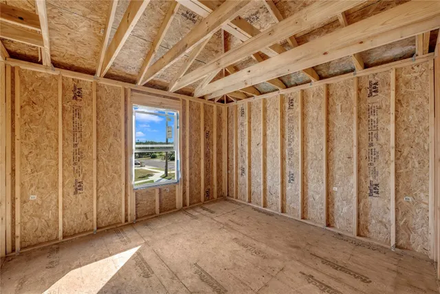 a view of a bathroom with a tub and shower