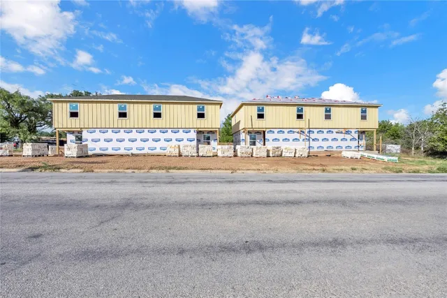 a view of a building with sitting area