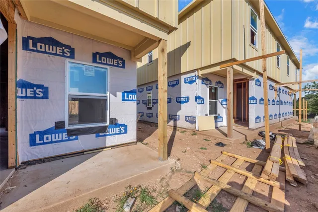 a view of a room with large windows