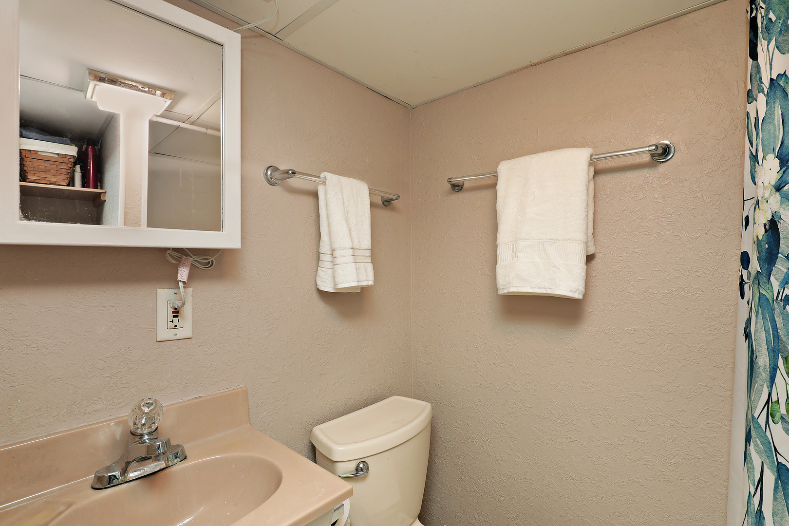 1001 Longaker Road Northbrook, IL 60062 - Photo 11 of 17 a white toilet sitting next to a bathroom sink