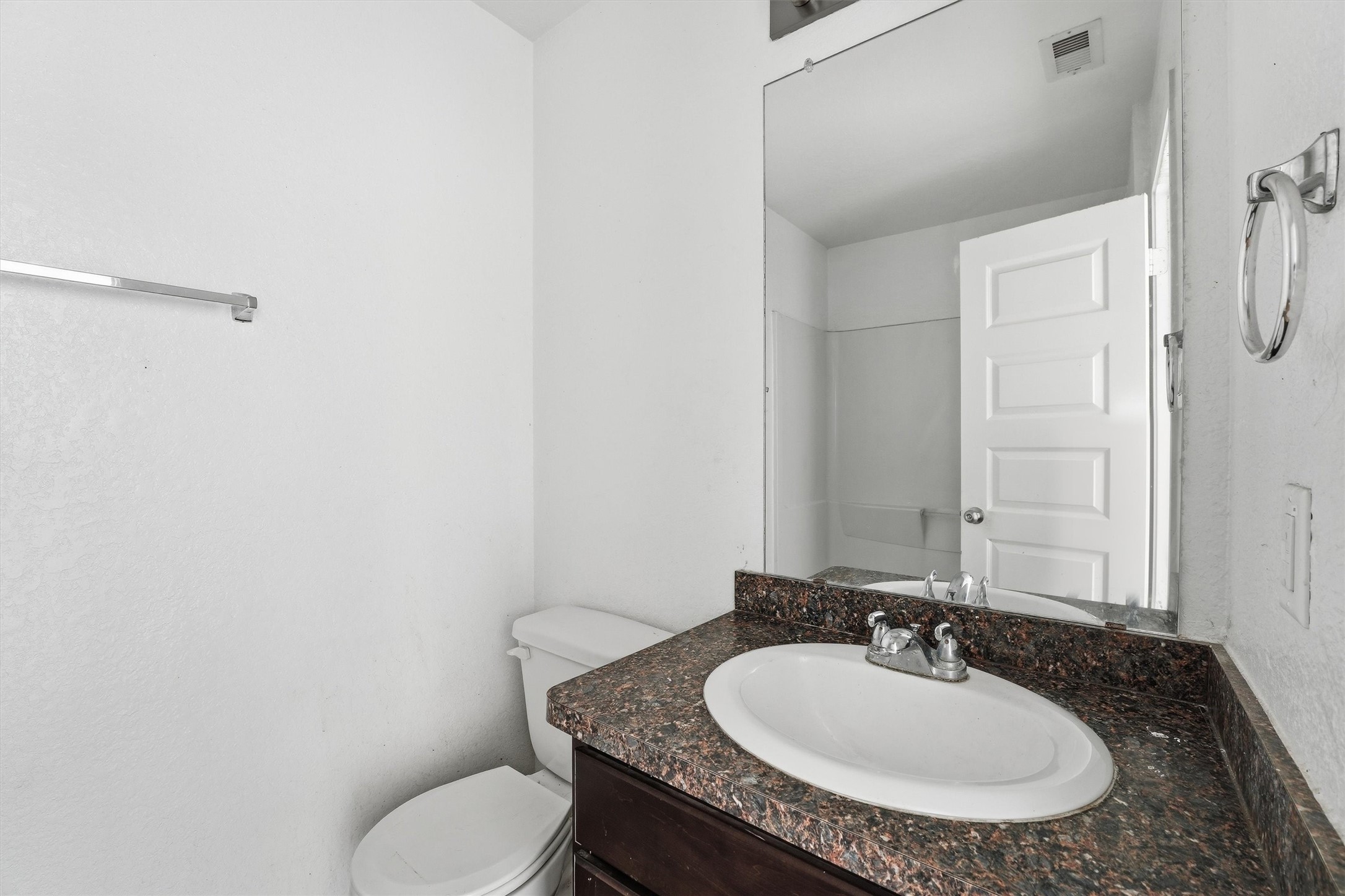 1634 Road 5102 Cleveland, TX 77327 - Photo 16 of 21 a bathroom with a granite countertop toilet sink and mirror