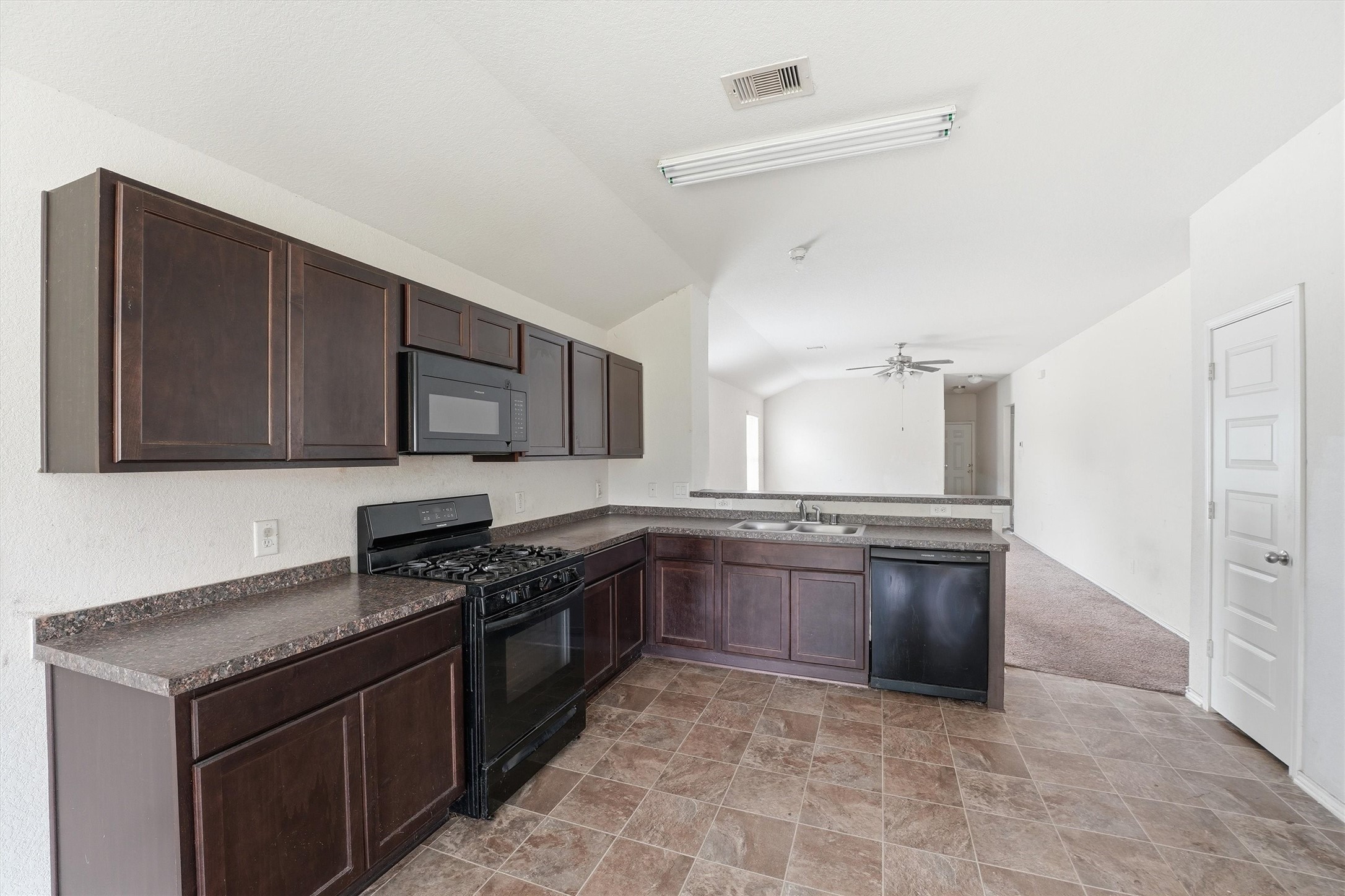 1634 Road 5102 Cleveland, TX 77327 - Photo 8 of 21 a kitchen with stainless steel appliances granite countertop a stove and a sink