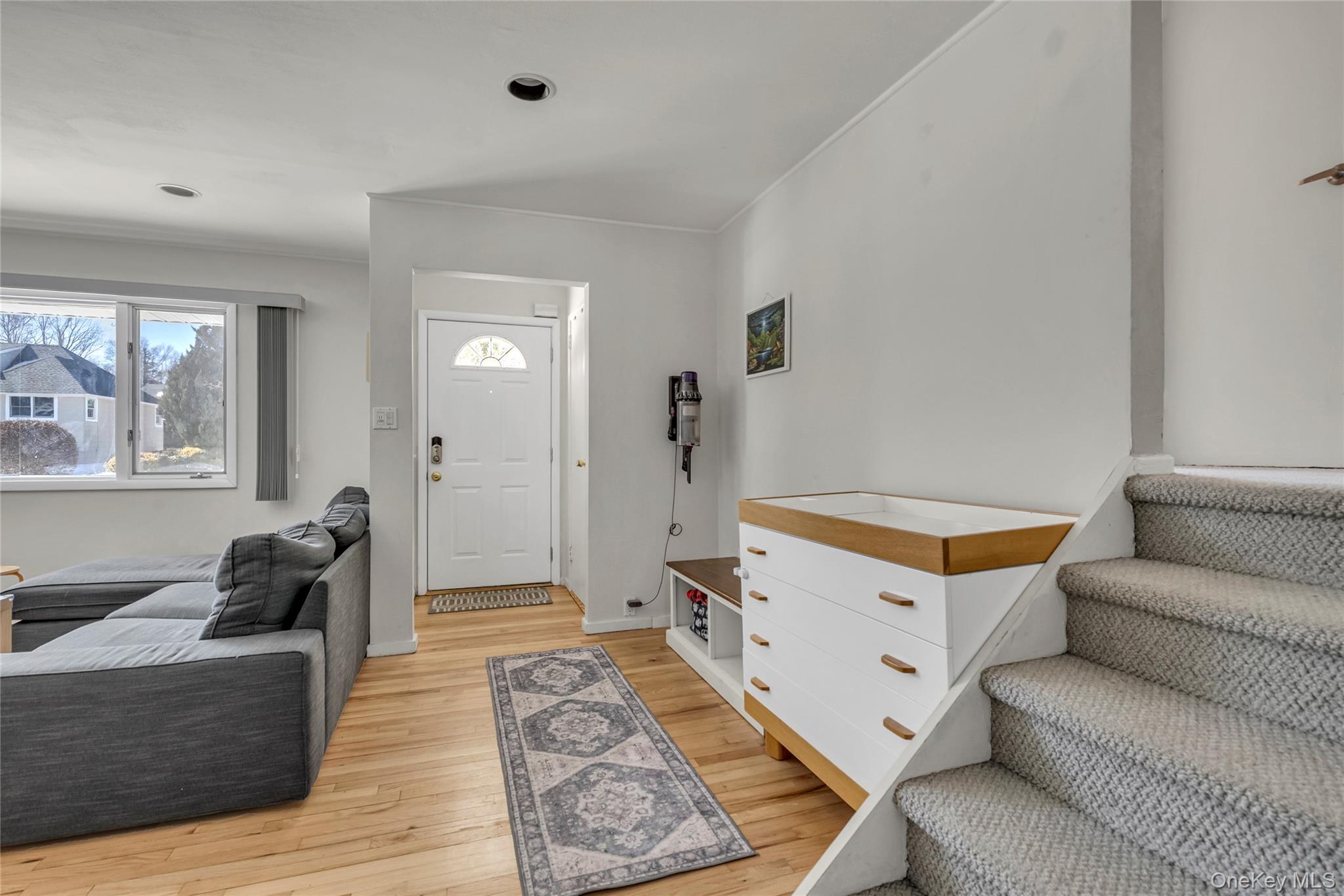 a living room with furniture and a rug