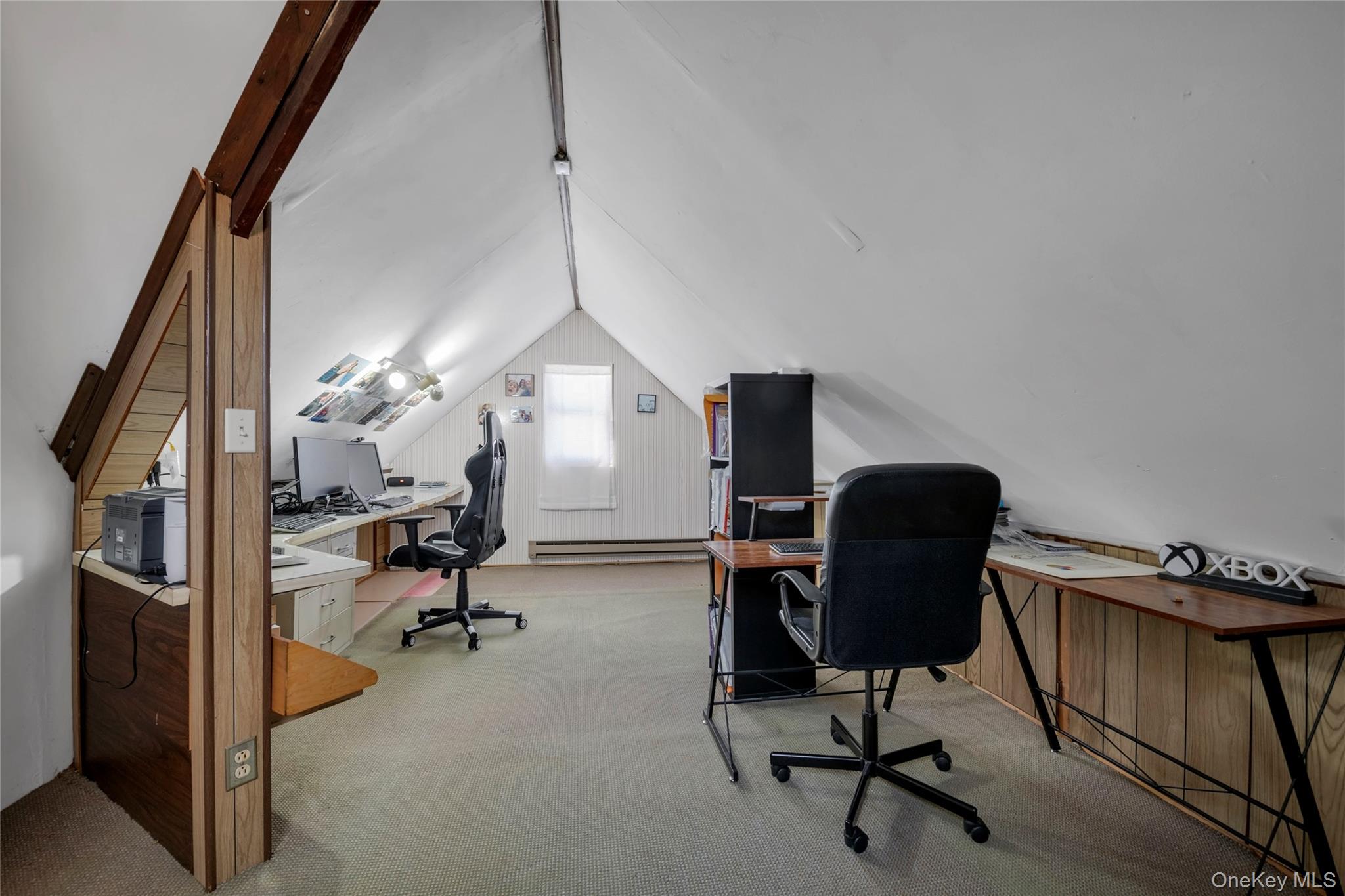 34 Roxbury Road Port Washington, NY 11050 - Photo 15 of 18 a view of a workspace with furniture and a window