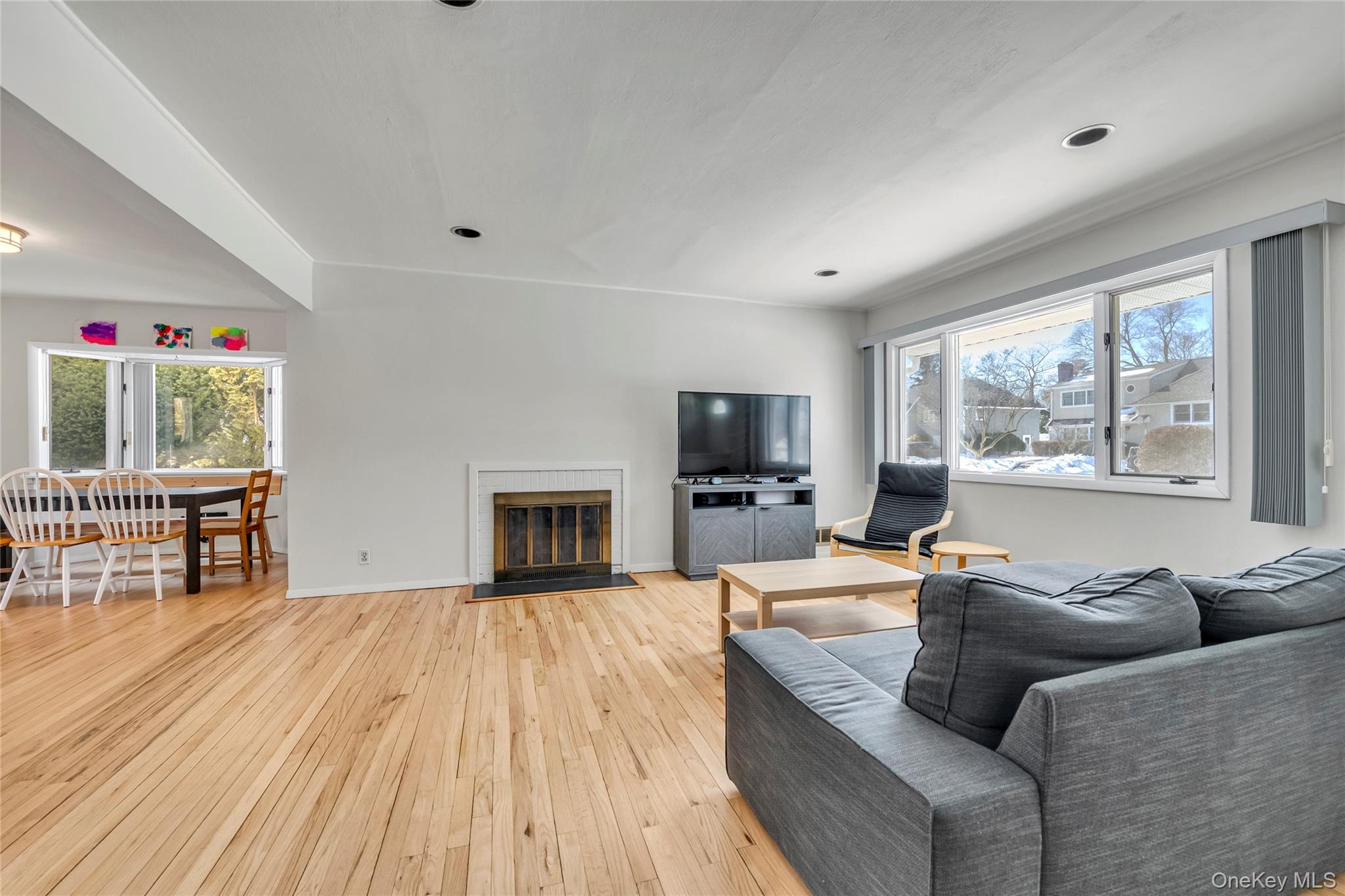 34 Roxbury Road Port Washington, NY 11050 - Photo 3 of 18 a living room with furniture large window and flat screen tv