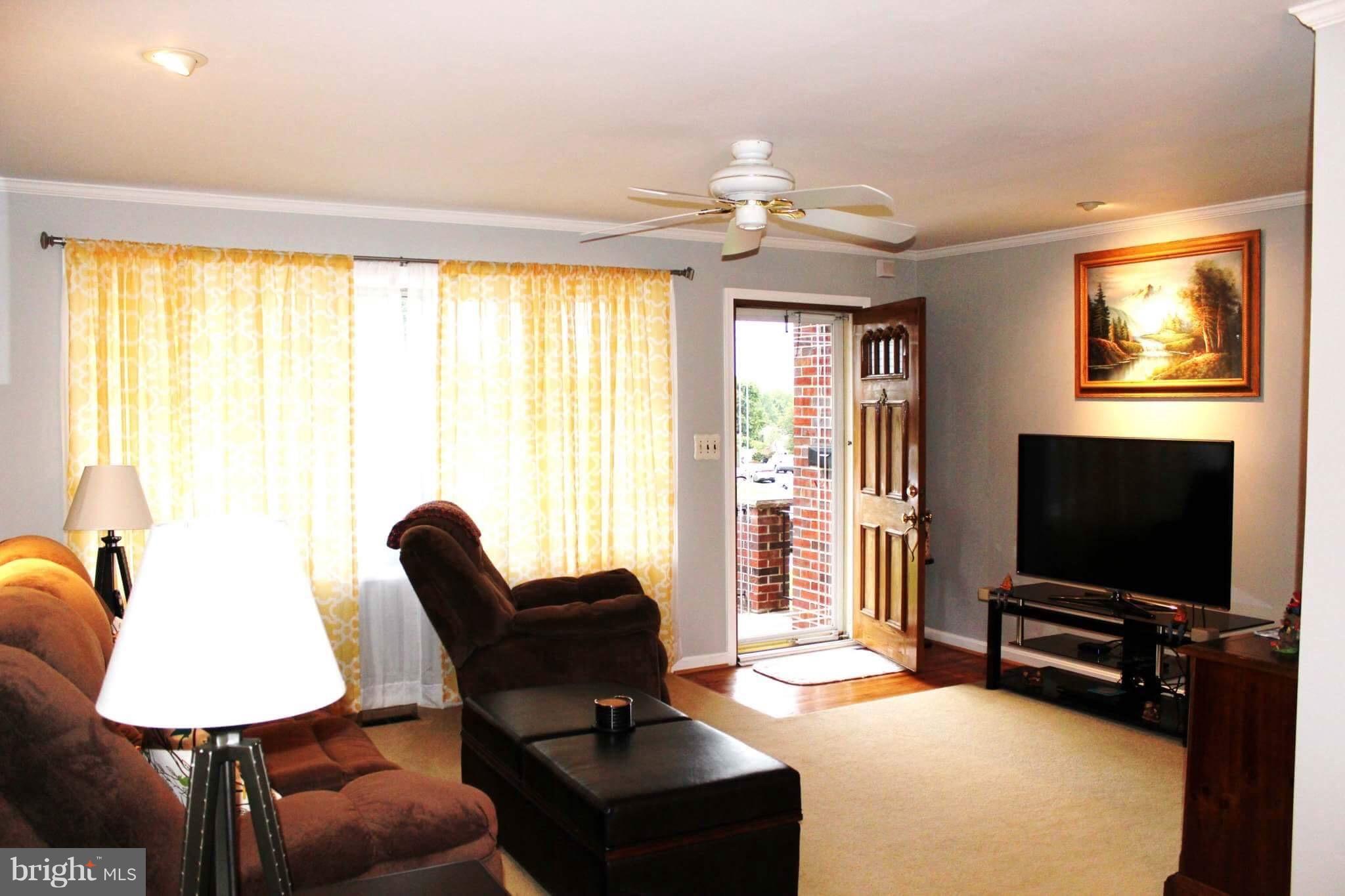 1507 National Road Baltimore, MD 21237 - Photo 3 of 30 a living room with furniture and a flat screen tv