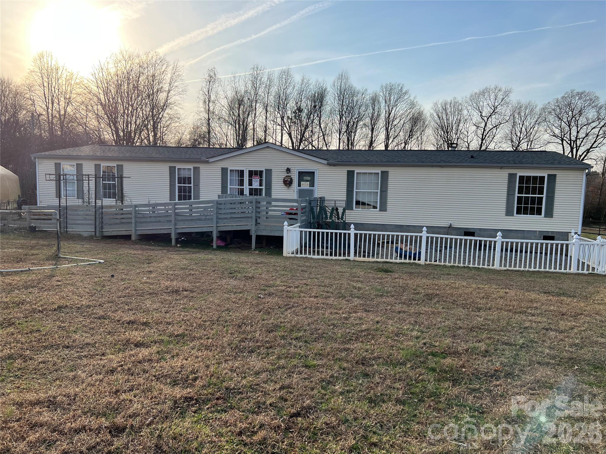 a house that has a tree in front of it