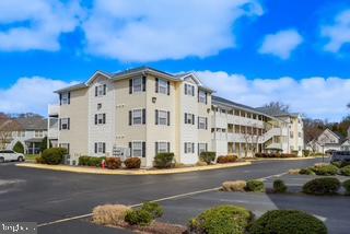 17293 King Phillip Way, Unit 10 Lewes, DE 19958 - Photo 1 of 14 a large building with a street view