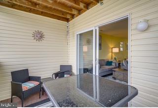 17293 King Phillip Way, Unit 10 Lewes, DE 19958 - Photo 11 of 14 view of livingroom with outdoor seating