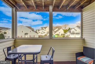 17293 King Phillip Way, Unit 10 Lewes, DE 19958 - Photo 12 of 14 a view of a balcony with furniture and outside view