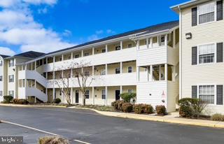 17293 King Phillip Way, Unit 10 Lewes, DE 19958 - Photo 14 of 14 a front view of a building with street view