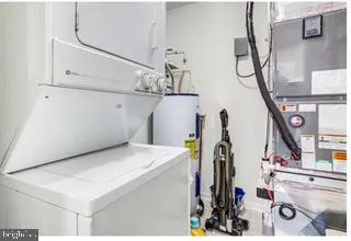 a view of gym equipment and kitchen view