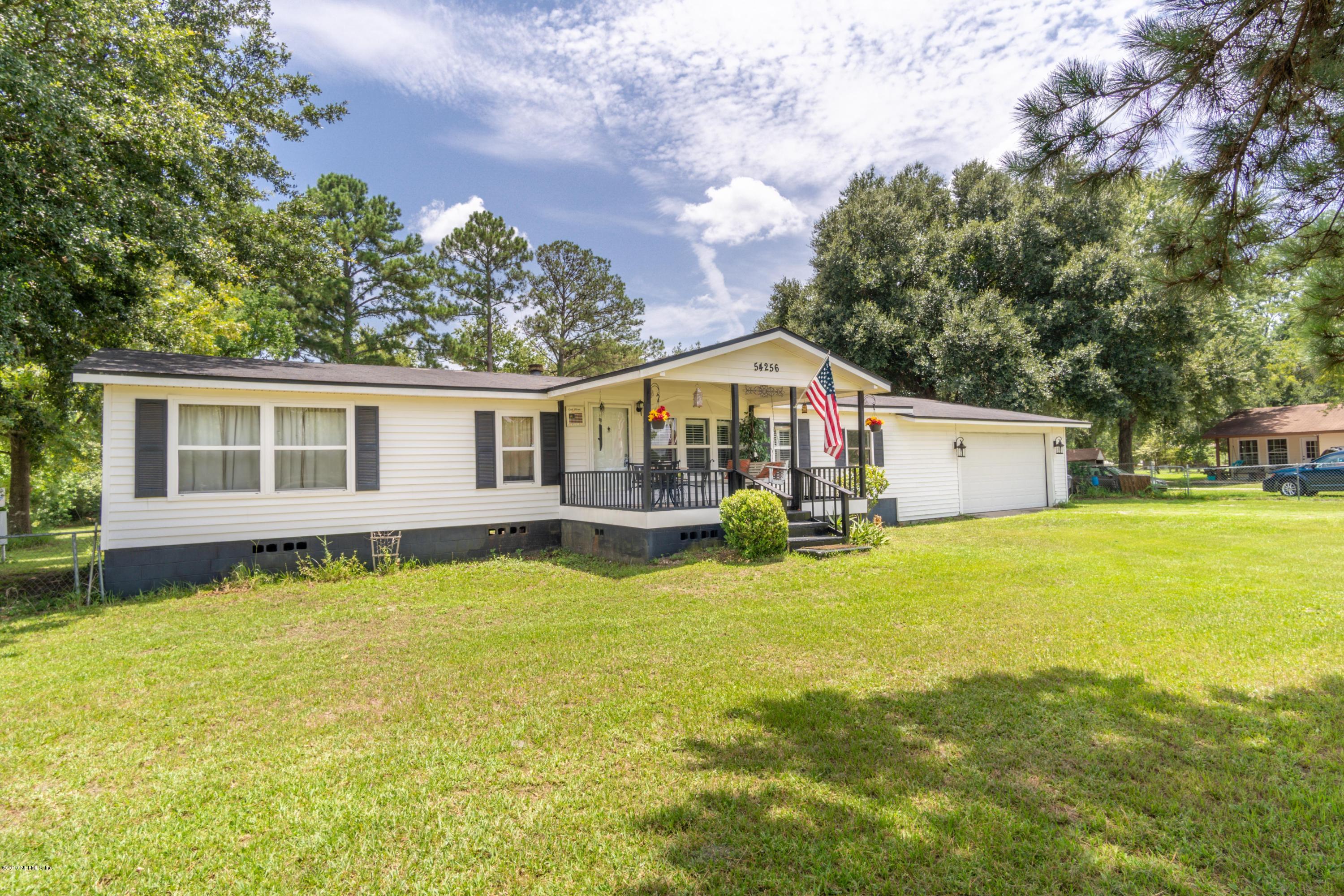 54256 Dornbush Road Callahan, FL 32011 - Photo 1 of 60 a view of a house with a yard and a tree