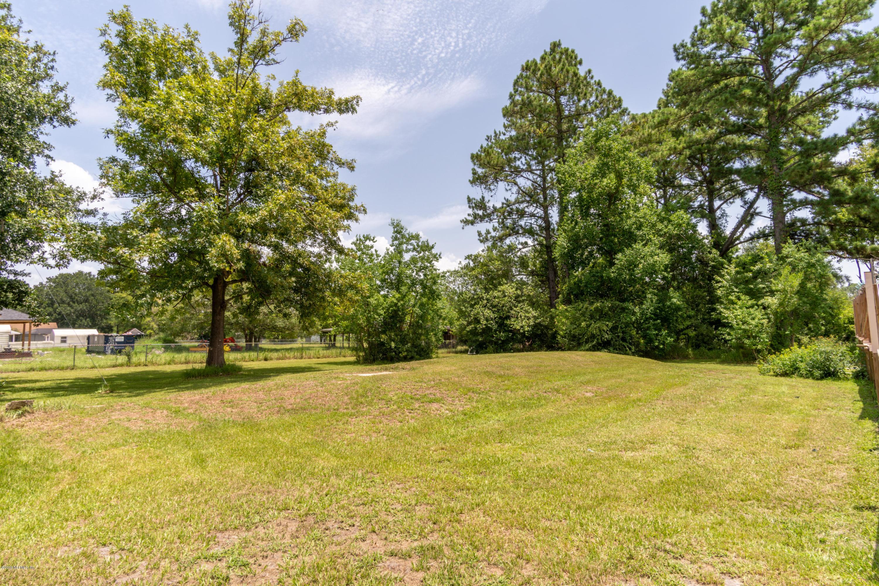 54256 Dornbush Road Callahan, FL 32011 - Photo 49 of 60 a view of empty space with swimming pool and trees