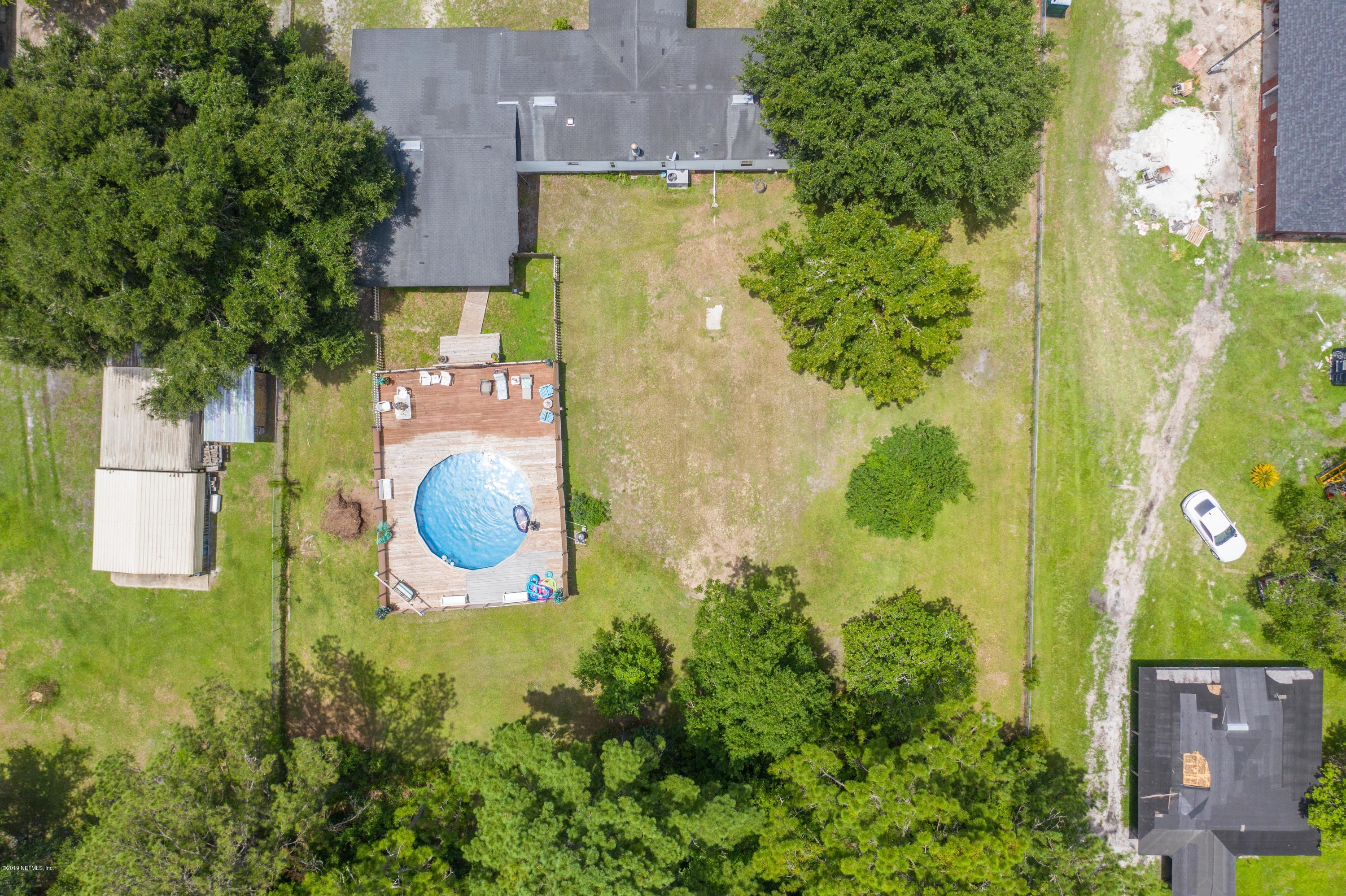 54256 Dornbush Road Callahan, FL 32011 - Photo 57 of 60 an aerial view of a house with a swimming pool