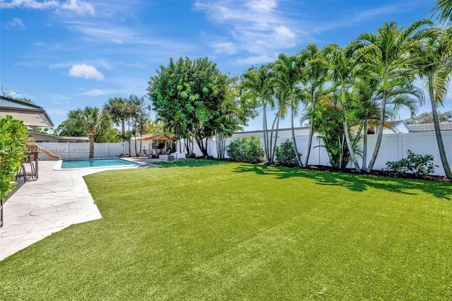 a view of a backyard with a garden