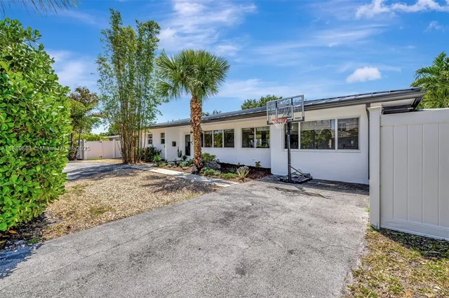 a view of house with yard and outdoor space