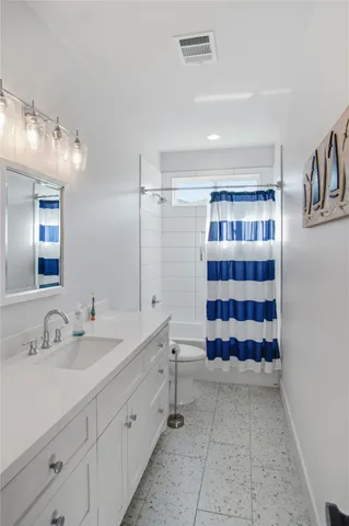 a bathroom with a double vanity sink mirror and double