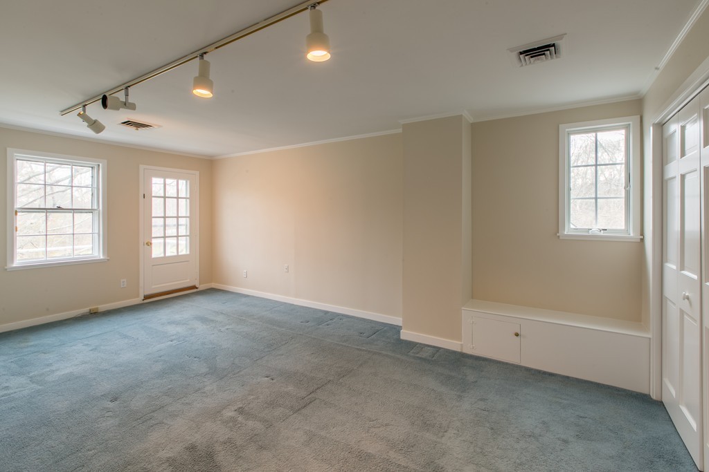 111 Barretts Mill Road Concord, MA 01742 - Photo 19 of 29 a view of an empty room with a window
