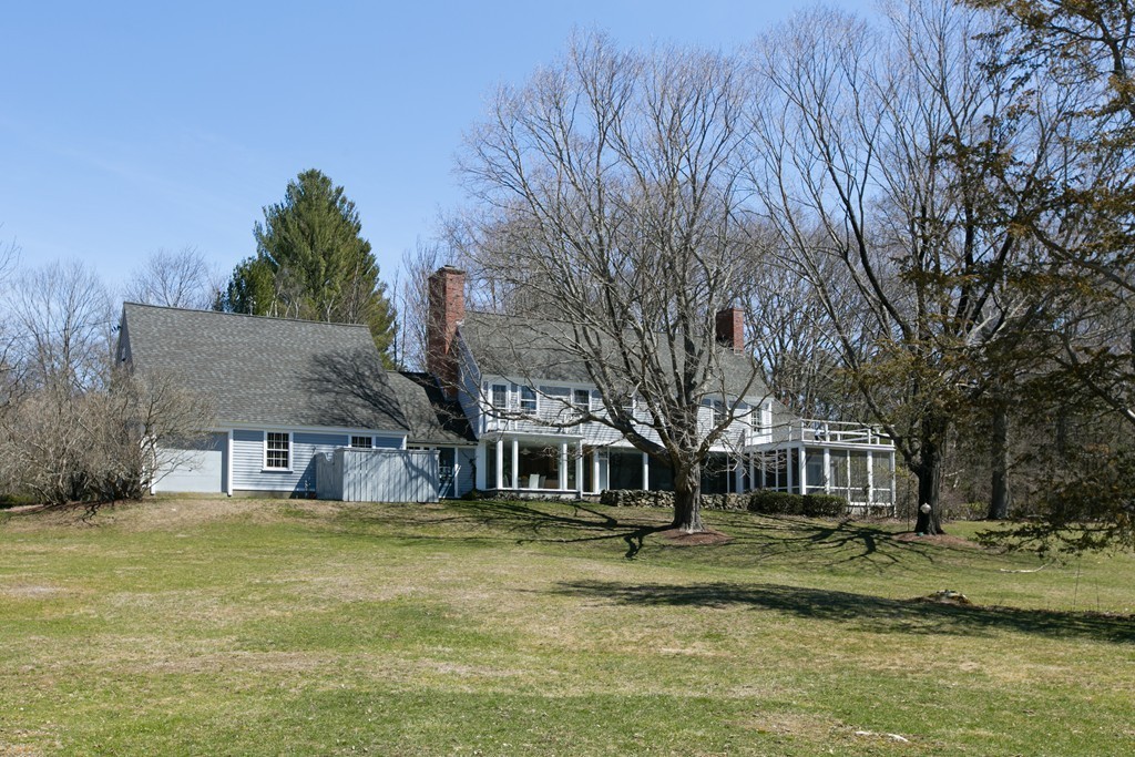 111 Barretts Mill Road Concord, MA 01742 - Photo 23 of 29 a front view of a house with a garden