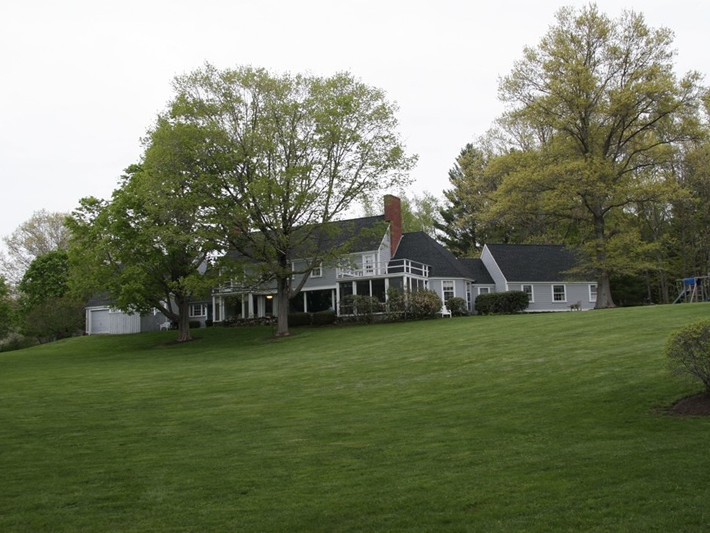 111 Barretts Mill Road Concord, MA 01742 - Photo 25 of 29 a front view of a house with a garden