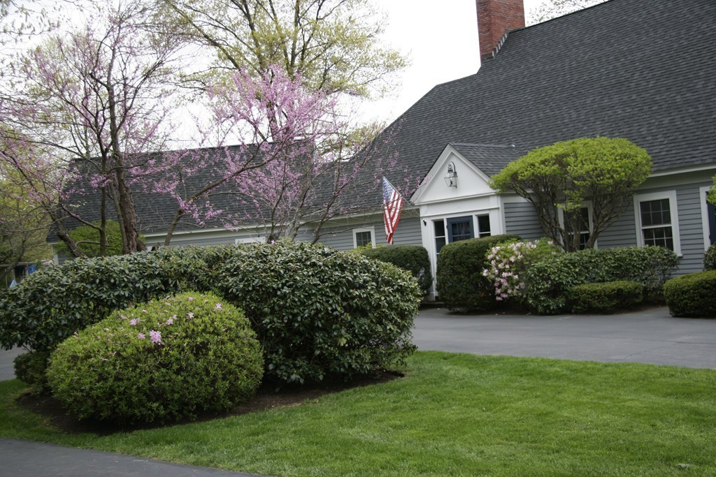 111 Barretts Mill Road Concord, MA 01742 - Photo 3 of 29 a front view of a house with a garden