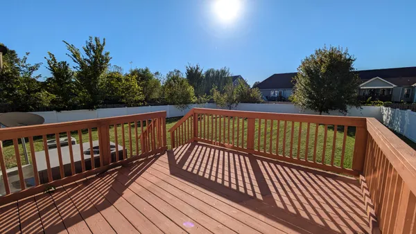 a view of a backyard of the house