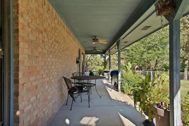 a view of a park with large trees
