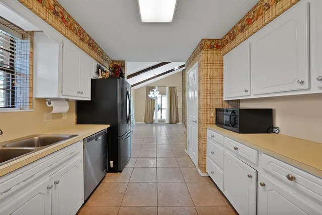 a bedroom with a bed and a ceiling fan