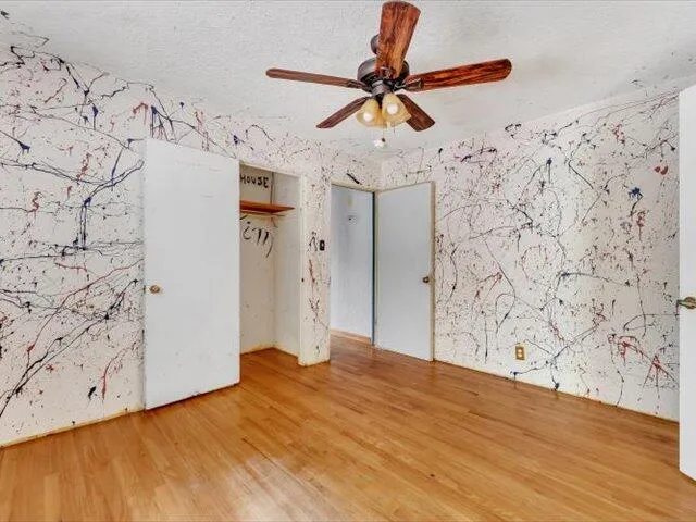 a view of a hallway with a wooden floor