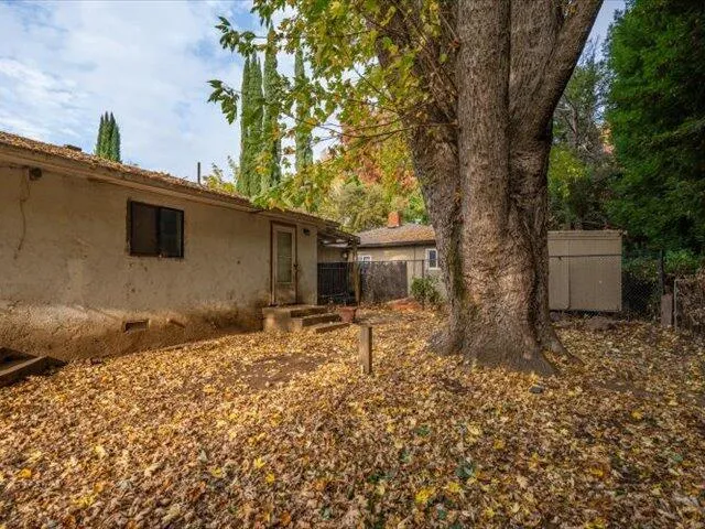 a backyard of a house with lots of green space