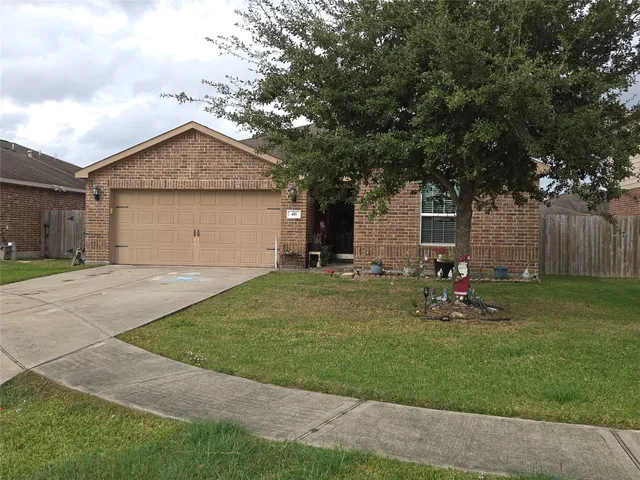a front view of house with yard and outdoor seating