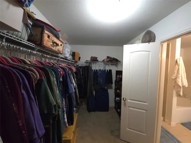 a hallway with furniture and wooden floor