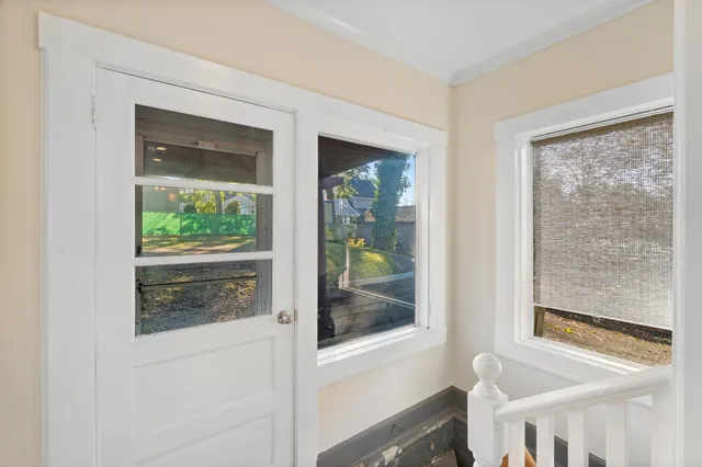 a view of a door and a window