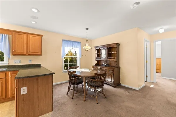 a view of a kitchen and dining room