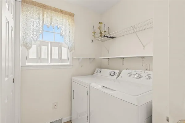 a utility room with dryer and washer