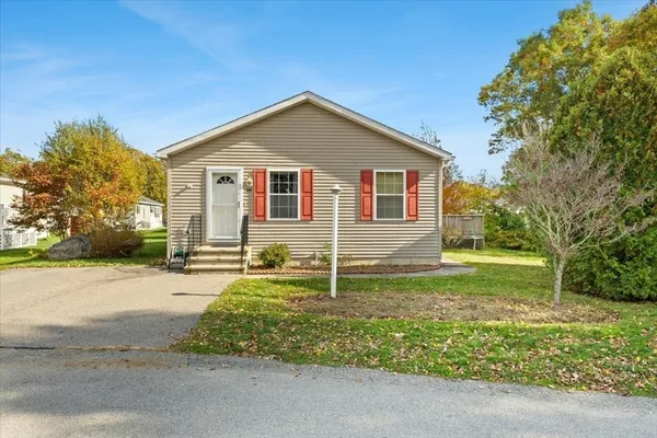 a house that is sitting in middle of the forest