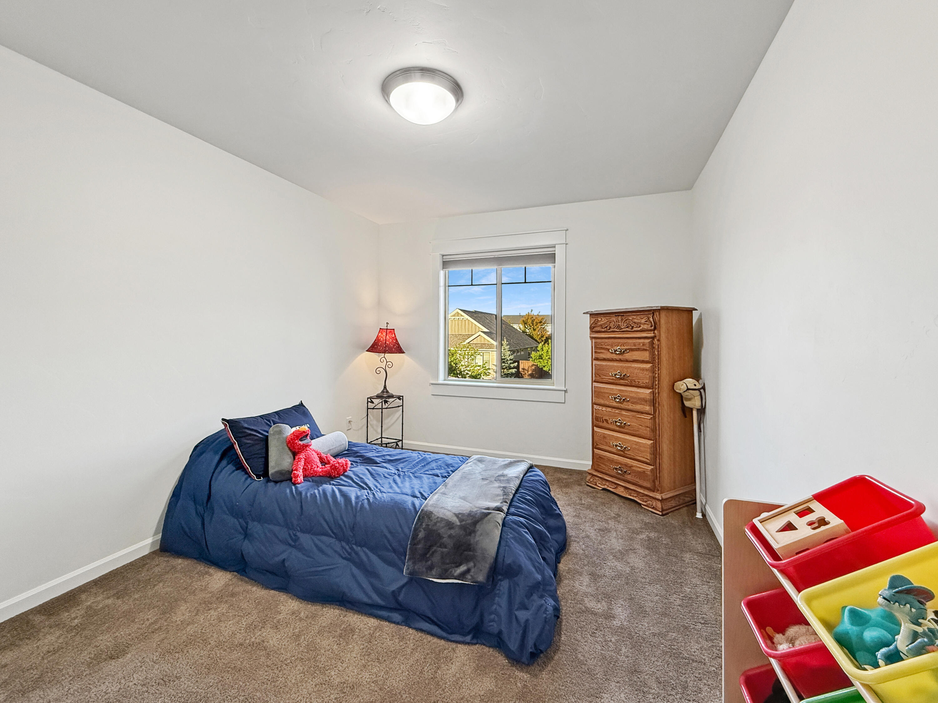 61072 Manhae Loop Bend, OR 97702 - Photo 31 of 63 a bedroom with a bed and a window
