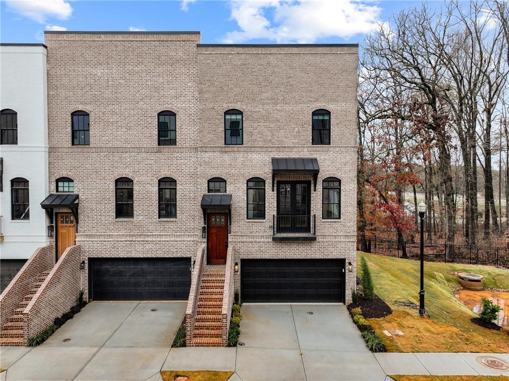 a front view of a house with garage