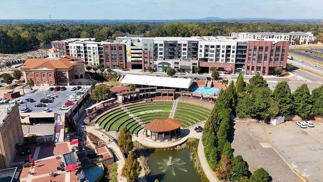 an aerial view of a house a yard and outdoor seating