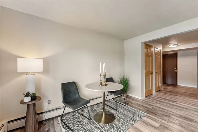a view of a livingroom with furniture and wooden floor
