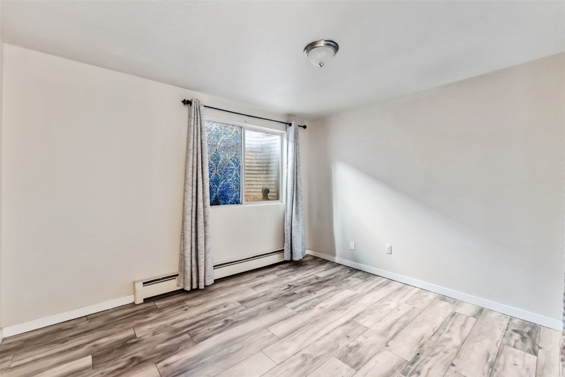 535 Straight Creek Drive, Unit 104 Dillon, CO 80435 - Photo 20 of 30 a view of empty room with wooden floor and fan