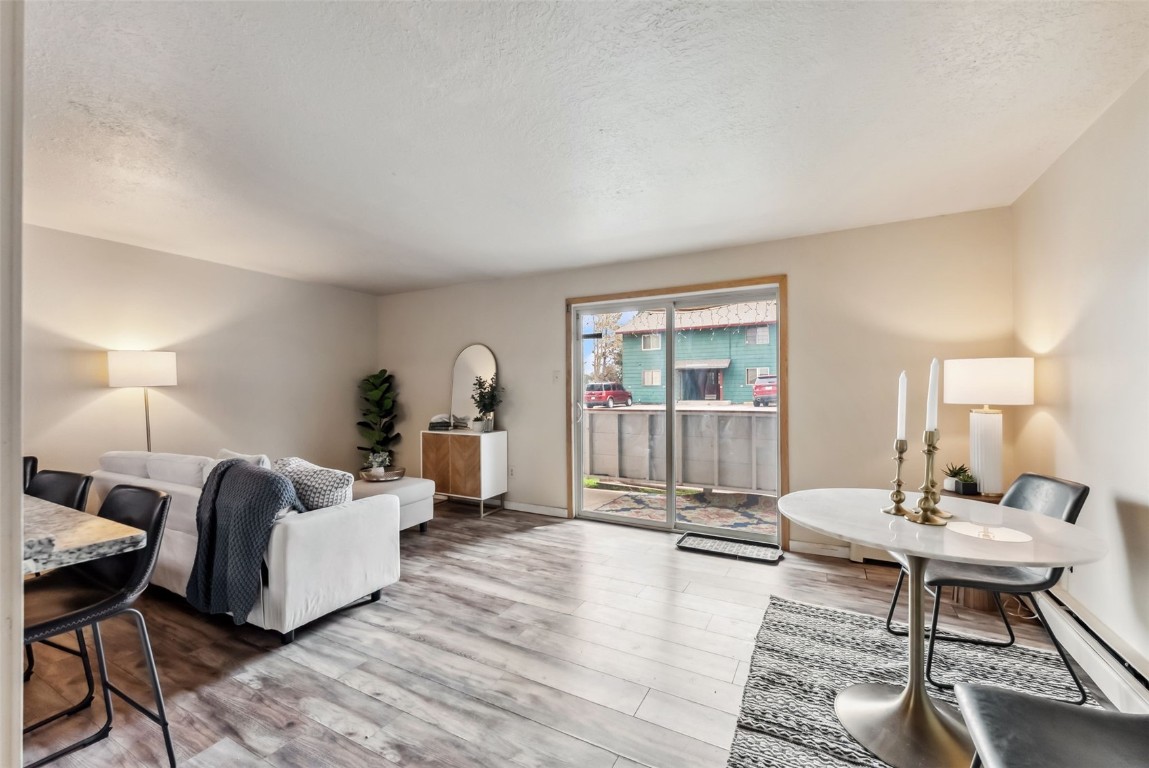 535 Straight Creek Drive, Unit 104 Dillon, CO 80435 - Photo 8 of 30 a living room with furniture and wooden floor
